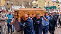 Cork GAA legend Jimmy Lynam made his final journey to the sound of ‘The Banks’