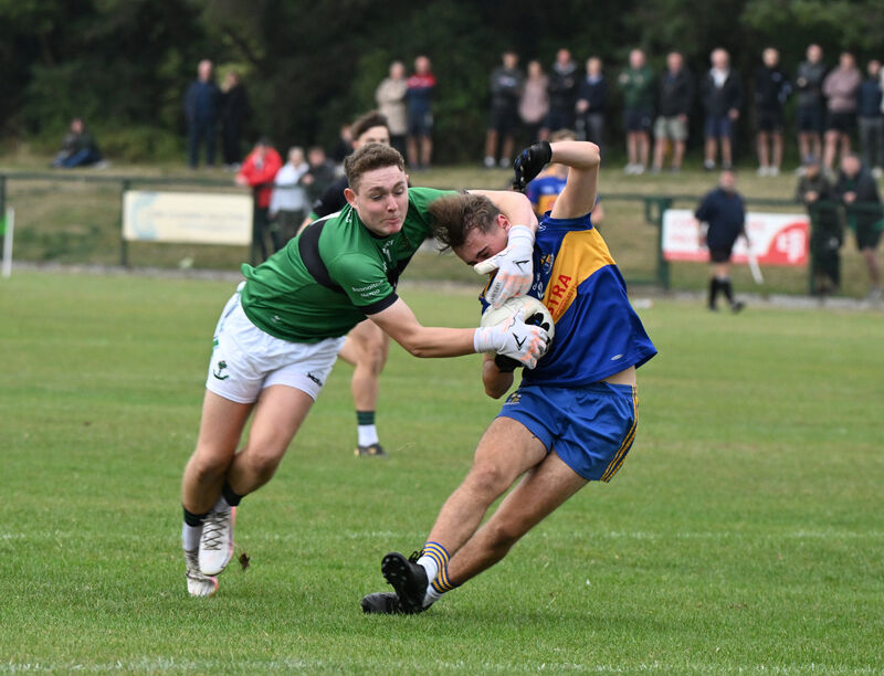 A goal-bound Conor Murphy of Carrigaline is fouled by Nemo Rangers goalkeeper Callum McCarthy-O'Donovan. Picture: Larry Cummins A goal-bound Conor Murphy of Carrigaline is fouled by Nemo Rangers goalkeeper Callum McCarthy-O'Donovan. Picture: Larry Cummins