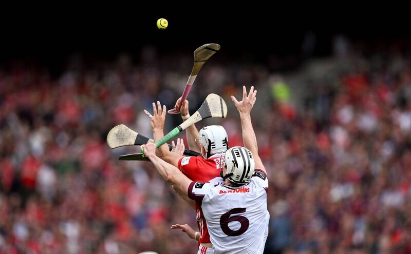 Alan Walsh of Cork is tackled by Darren Morrissey and Daithí Burke of Galway back in July. Picture: Ray McManus/Sportsfile