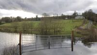 Farm Gates submerged in a Flooded area after Rainstorm