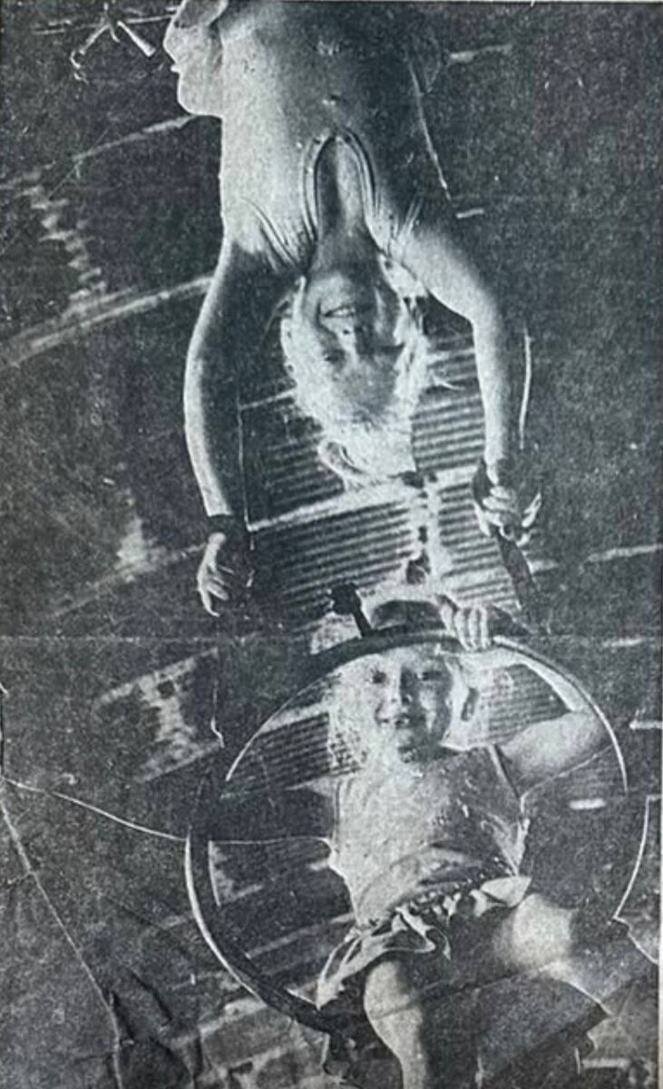 Elaine Courtney, age 7, performing high in the roof of a circus Big Top. Elaine Courtney, age 7, performing high in the roof of a circus Big Top.