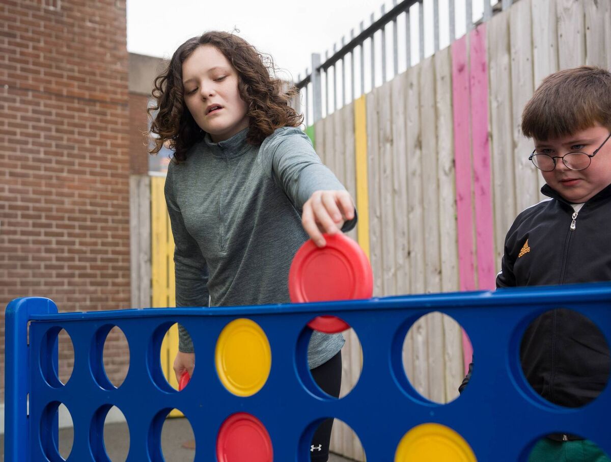 Lily and Darragh enjoying a fun game at the school 
