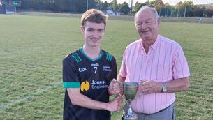 <p>Myles Barry presents U21 B football trophy the trophy to the captain of the victorious Diarmuid Ó Murchú team, Fionn Mansfield following their victory over Ballymartle. </p> <p>Myles Barry presents U21 B football trophy the trophy to the captain of the victorious Diarmuid Ó Murchú team, Fionn Mansfield following their victory over Ballymartle. </p>