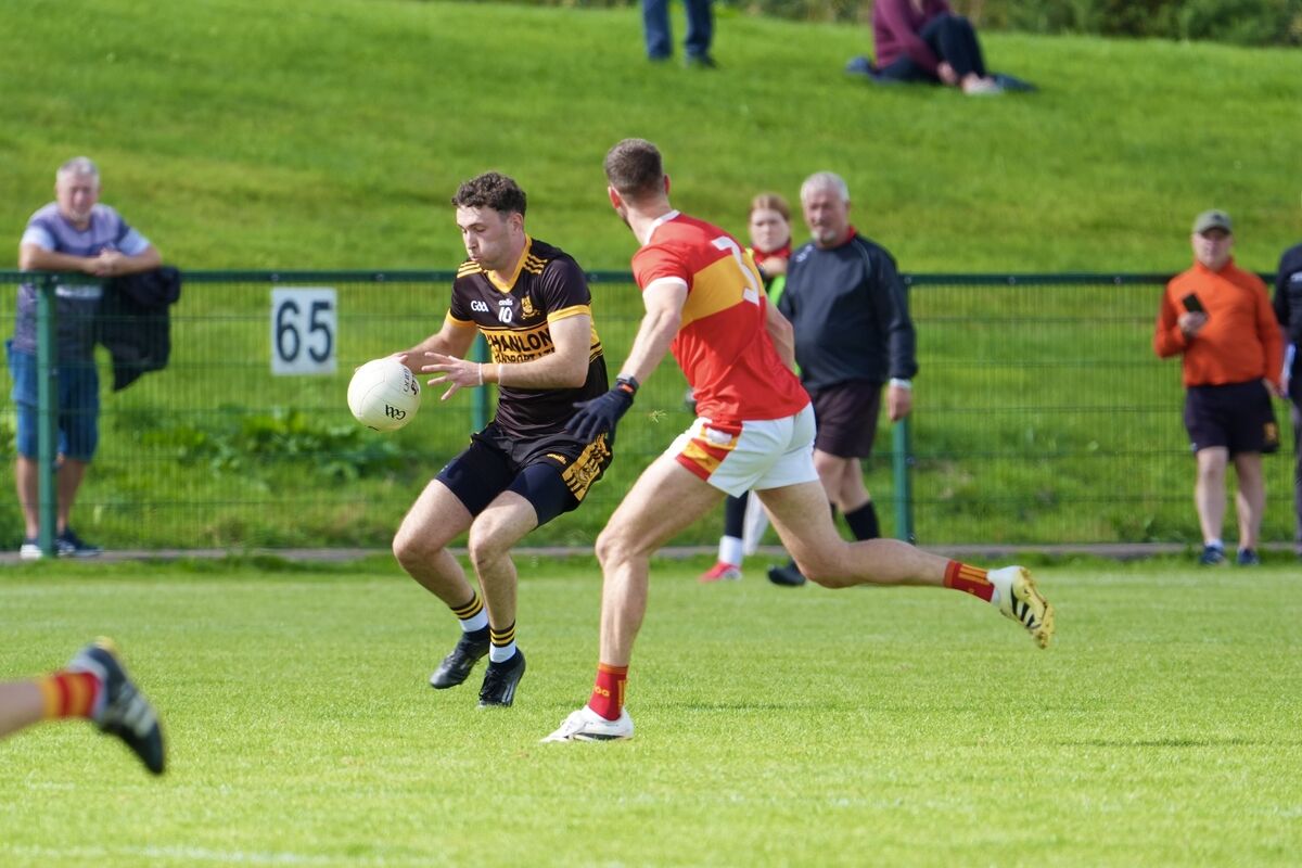 Éire Óg’s Michael Corkery competes with Clyda Rovers' Kevin Graham for possession. Picture: Noel Sweeney