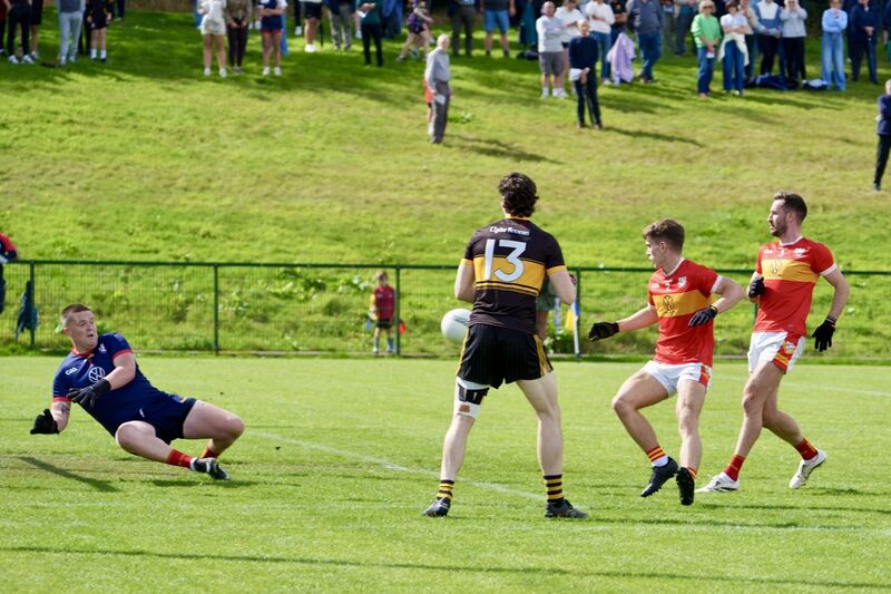 Éire Óg goalkeeper Chris Kelly makes a save against Clyda Rovers. Picture: Noel Sweeney