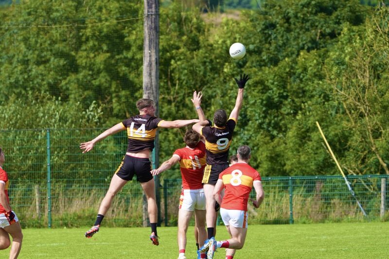 The teams battle for a high ball. Picture: Noel Sweeney