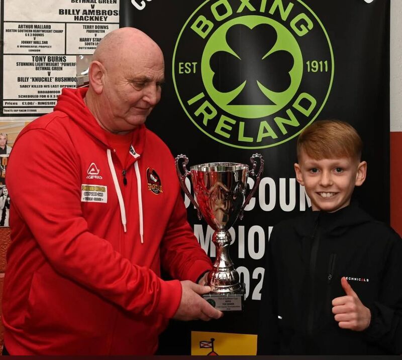 Cork Boxing: Paddy McSweeney presents the Tim O'Sullivan Cup to Sean Quigley Cove, as Best boxer of the County Championships. 