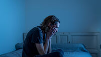 Devastated millennial man crying sad feeling hurt and hopeless suffering Depression. Depressed teenager victim of bullying or ab