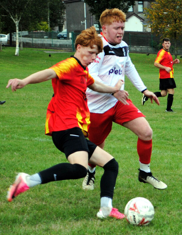 Mogeely's Luke Keane gets his pass away as Shandon's Dylan McCarthy closes in. Picture: Barry Peelo.