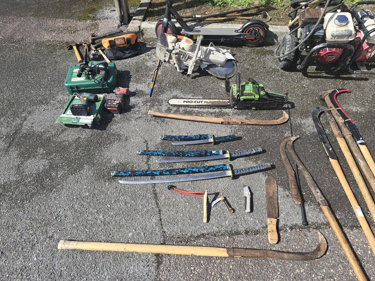 The weapons seized included slash hooks, hammers, baseball bats, machetes, swords and slingshots. Two caravans were also seized.