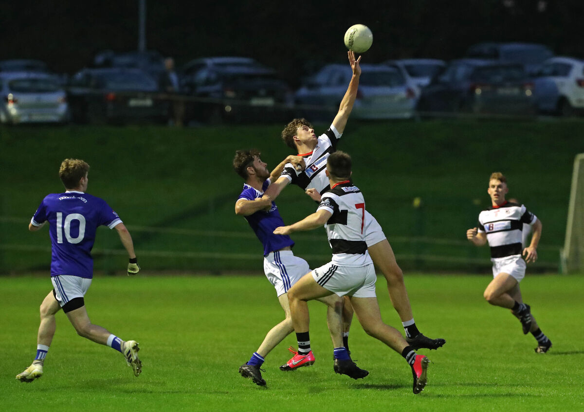 Robert Downey of St Nick's battles for the high ball against Naomh Abán. Picture: Jim Coughlan Robert Downey of St Nick's battles for the high ball against Naomh Abán. Picture: Jim Coughlan
