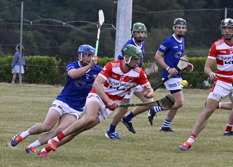 Tadhg O'Sullivan of Courcey Rovers gets ahead of Ballinhassig's Darragh O'Sullivan - the two neighbouring clubs and the other sides in their group, Carrigaline and Inniscarra, still hold qualification hopes. Picture: Martin Walsh Tadhg O'Sullivan of Courcey Rovers gets ahead of Ballinhassig's Darragh O'Sullivan - the two neighbouring clubs and the other sides in their group, Carrigaline and Inniscarra, still hold qualification hopes. Picture: Martin Walsh