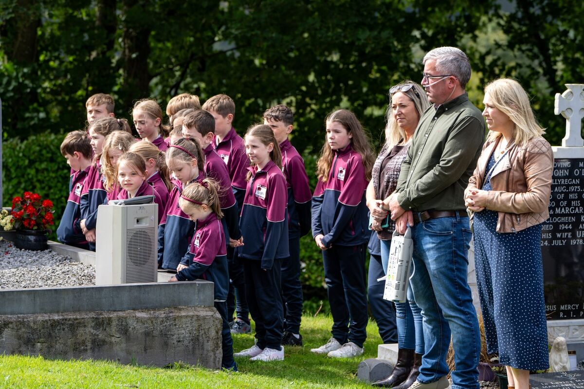 Children from Grennan Primary School in Ballincollig prepare a guard of honour.