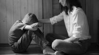 Parent comforting helping sad emotional child at home, concept of bullying, stress disappointment, sadness.