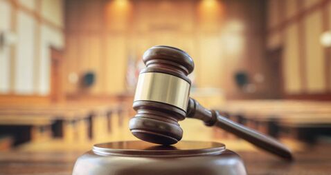 Judges gavel in courtroom legal trial and law background