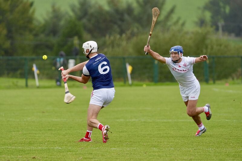 Watergrasshill’s Daire O’Leary shoots for a point as Blarney’s Stephen Mullane closes in. Picture: Noel Sweeney