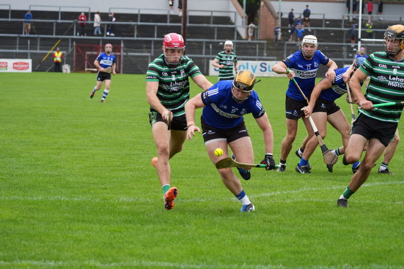  Sarsfields' Daniel Hogan tries to hold off Eoin O'Flynn of Douglas. Picture: Noel Sweeney