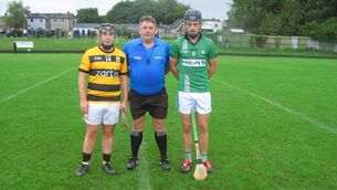 <p>Referee Trevor Lyons accompanied by Michael Sheehan (Na Piarsaigh) and Ruairí Quinlan (White's Cross) at Ballinlough.</p> <p>Referee Trevor Lyons accompanied by Michael Sheehan (Na Piarsaigh) and Ruairí Quinlan (White's Cross) at Ballinlough.</p>