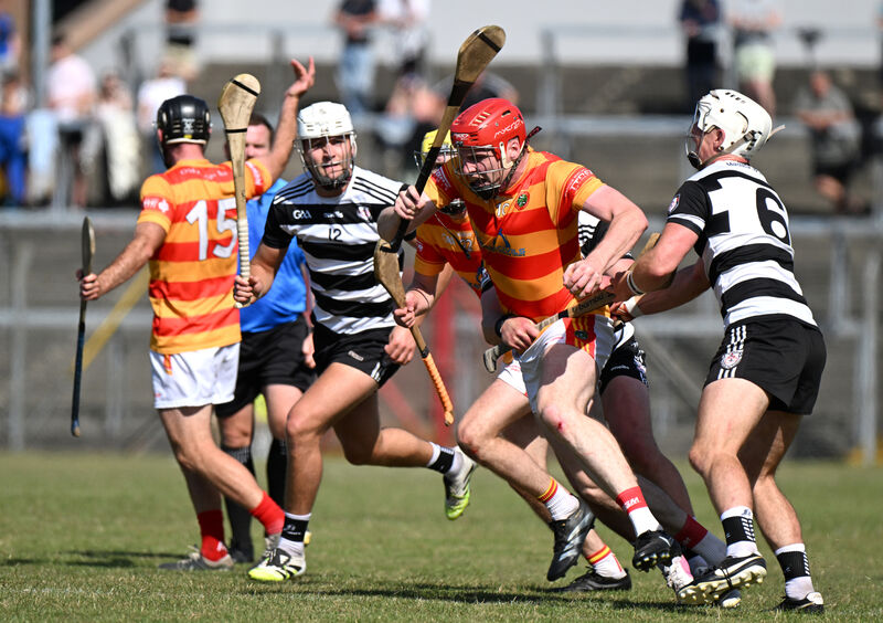 David Buckley drives out for Newcestown against Midleton. Picture: Larry Cummins David Buckley drives out for Newcestown against Midleton. Picture: Larry Cummins
