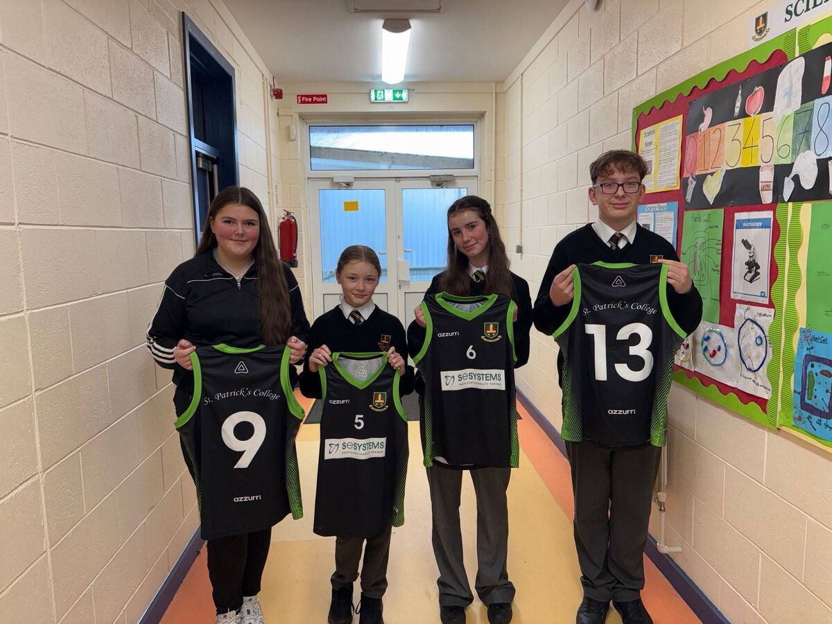 Students with the school’s basketball jerseys. St Patrick’s fields basketball and soccer teams for both boys and girls. 