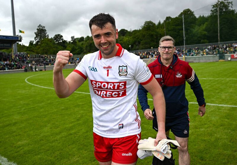 Cork goalkeeper Patrick Doyle and coach Kevin Murray celebrate after the Donegal win. Picture: Ramsey Cardy/Sportsfile