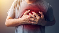Adult male with heart attack or heart burn condition, health and medicine concept