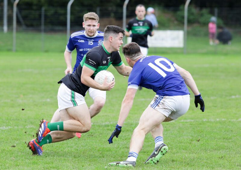 Nemo Rangers' Callum O'Neill in action against Naomh Abán's Aodhán Ó Luasa. Picture: David Creedon Nemo Rangers' Callum O'Neill in action against Naomh Abán's Aodhán Ó Luasa. Picture: David Creedon