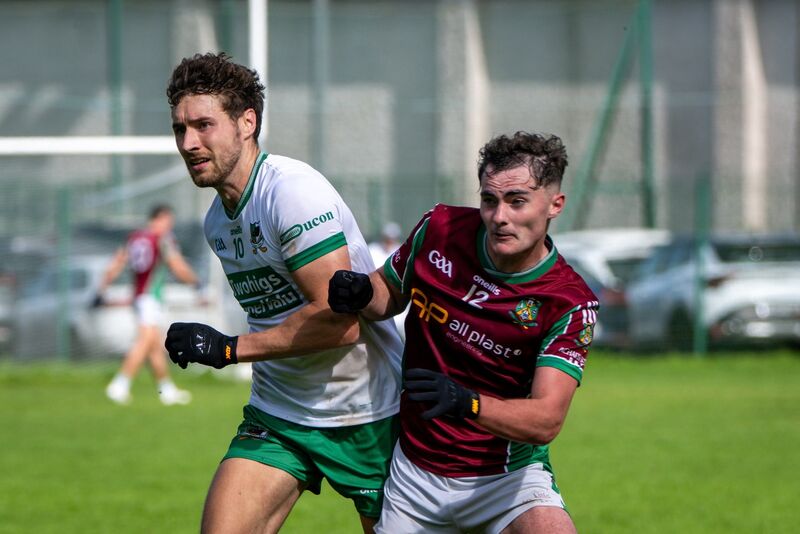 Aghabullogue's Aaron O'Sullivan and Kanturk captain Paul Walsh go shoulder to shoulder. Picture: Chani Anderson Aghabullogue's Aaron O'Sullivan and Kanturk captain Paul Walsh go shoulder to shoulder. Picture: Chani Anderson