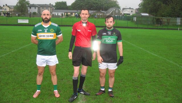 <p>Referee James Regan, accompanied by Alan Nolan (St. Michael's) and Aaron Browne (Nemo Rangers) before their JAFC clash in Ballinlough.</p>