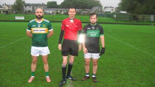 <p>Referee James Regan, accompanied by Alan Nolan (St. Michael's) and Aaron Browne (Nemo Rangers) before their JAFC clash in Ballinlough.</p>