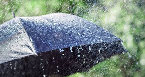 Rain on umbrella background, weather forecast and environment concept