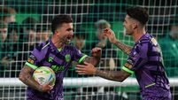 Seani Maguire celebrates with Ruairi Keating after scoring his side's first goal 4/9/2026