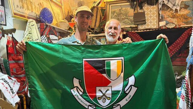 <p> James Ryan from Fermoy in Cork, who volunteered with the anti-occupation initiative Protective Presence, with a shop owner in Palestine who presented him with a GAA Palestine flag.</p> <p> James Ryan from Fermoy in Cork, who volunteered with the anti-occupation initiative Protective Presence, with a shop owner in Palestine who presented him with a GAA Palestine flag.</p>