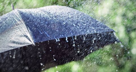 Rain on umbrella background, weather forecast and environment concept