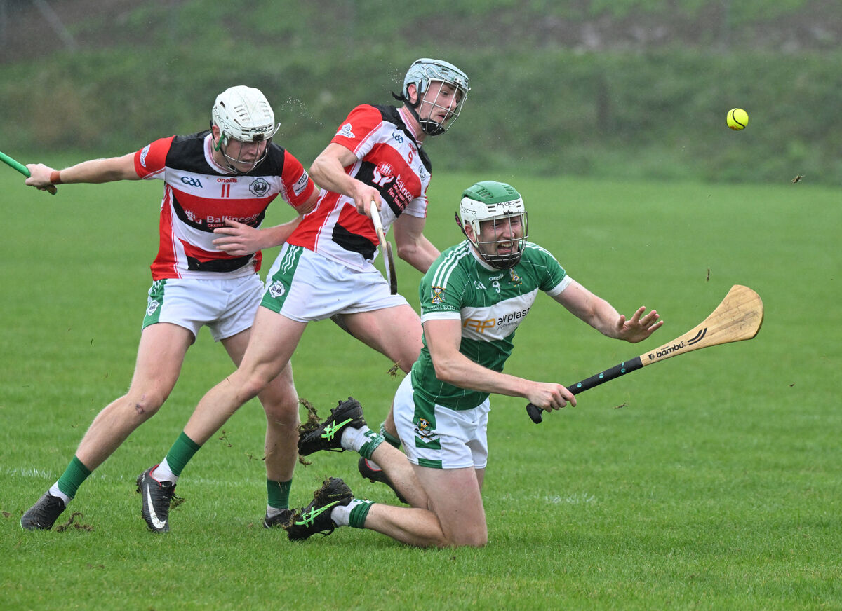 Sean Feury of Aghabullogue tries to get the ball away under pressure from Ballincollig's Theo Morgan. Picture: Larry Cummins Sean Feury of Aghabullogue tries to get the ball away under pressure from Ballincollig's Theo Morgan. Picture: Larry Cummins