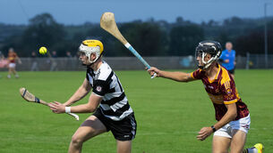 <p>Midleton's Peter Barrett takes on Youghal's Fionn Hill. Picture: Howard Crowdy</p>