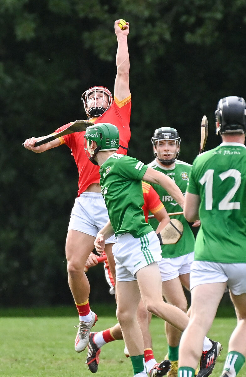 Mallow's Paul Lyons goes high to win possession against Aghada. Picture: David Keane. Mallow's Paul Lyons goes high to win possession against Aghada. Picture: David Keane.