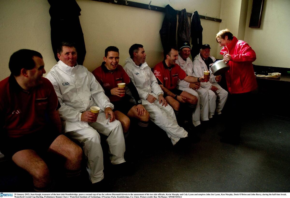 Joan Keogh, treasurer of the host club Sixmilebridge, pours a second cup of tea for referee Diarmuid Kirwin to the amusement of his two side officials, Kevin Murphy and Colm Lyons and umpires John Joe Lyons, Ken Murphy, Denis O'Brien and John Barry, during the half time break. Waterford Crystal Cup Hurling, Preliminary Round, Clare v Waterford Institute of Technology, O'Garney Park, Sixmilebridge, Co. Clare. Picture credit: Ray McManus / SPORTSFILE