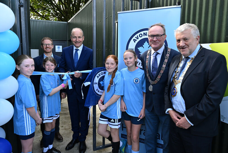 Taoiseach Micheál Martin, T.D performs the cutting of the ribbon to officially open the schoolgirls and schooboys dressing rooms of Avondale United at Beaumont Park, Cork. Under 12 schoolgirls Eva O'Regan, Sadie Minihan, Clara O'Sullivan and Libby Nagle give a helping hand, with Joe Plunkett, Club Chairperson , Deputy Lord Mayor Cllr Des Cahill and Paul Cooke, President, FAI at the ceremony. NO REPRO FEE Taoiseach Micheál Martin, T.D performs the cutting of the ribbon to officially open the schoolgirls and schooboys dressing rooms of Avondale United at Beaumont Park, Cork. Under 12 schoolgirls Eva O'Regan, Sadie Minihan, Clara O'Sullivan and Libby Nagle give a helping hand, with Joe Plunkett, Club Chairperson , Deputy Lord Mayor Cllr Des Cahill and Paul Cooke, President, FAI at the ceremony. NO REPRO FEE