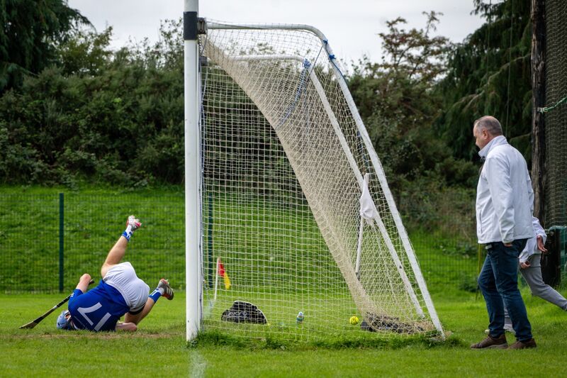 Ballinhassig’s Jamie Lyne makes a valiant effort to prevent a Watergrasshill goal. Picture: Chani Anderson