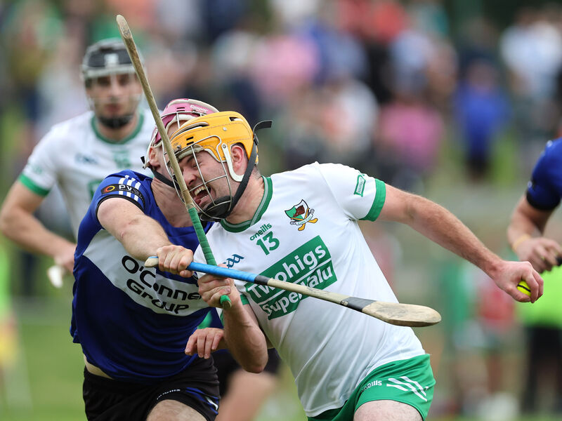 Donal English of Sarsfields up against Liam O'Keeffe of Kanturk. Picture: Jim Coughlan Donal English of Sarsfields up against Liam O'Keeffe of Kanturk. Picture: Jim Coughlan