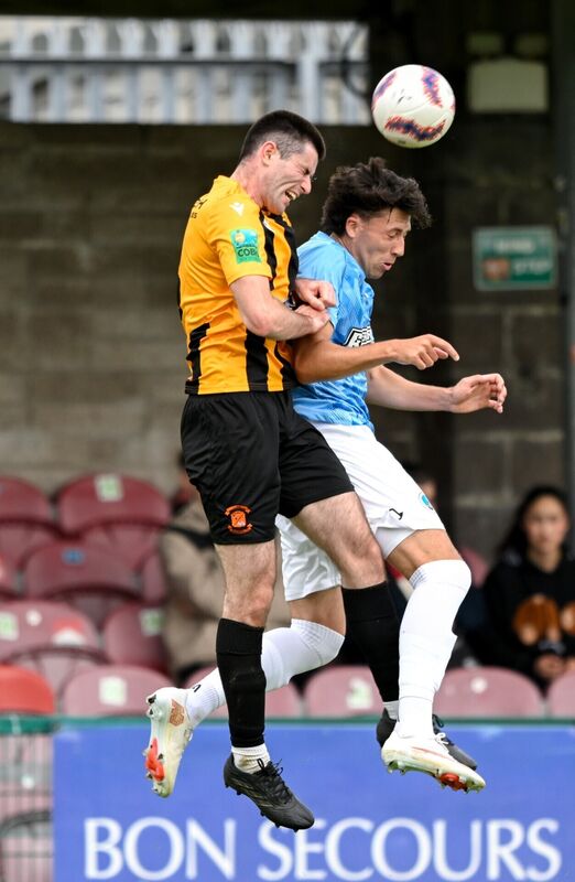 20 September 2026; Sean Cummins of Cobh Wanderers in action against Bradley Walsh of St Mary's AFC during the 2026 FAI Intermediate Cup Final between Cobh Wanderers and St Mary's at Munster FA Turners Cross Stadium in Cork. Photo by Eakin Howard/Sportsfile