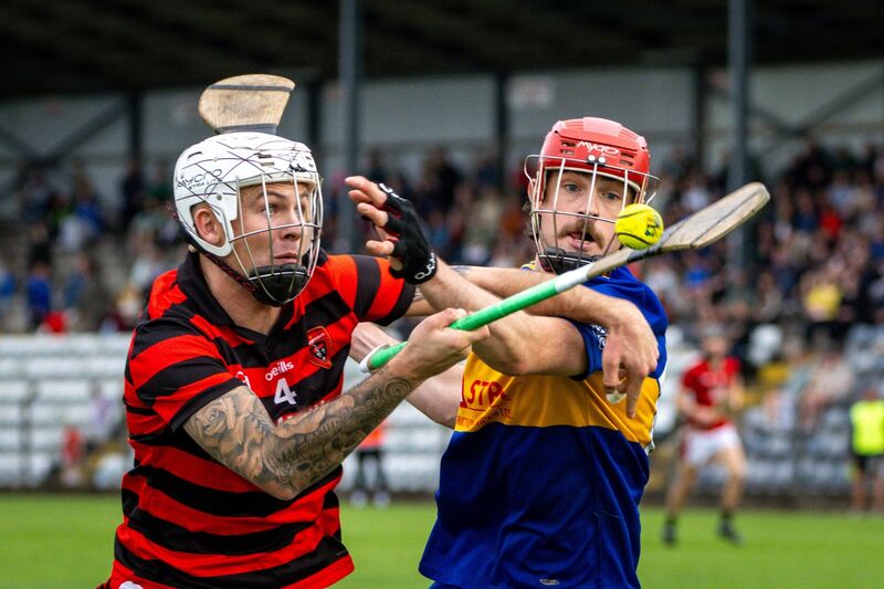 Cloyne’s Adam Sherlock and Carrigaline’s Kevin O’Reilly battle for possession. Picture: Chani Anderson