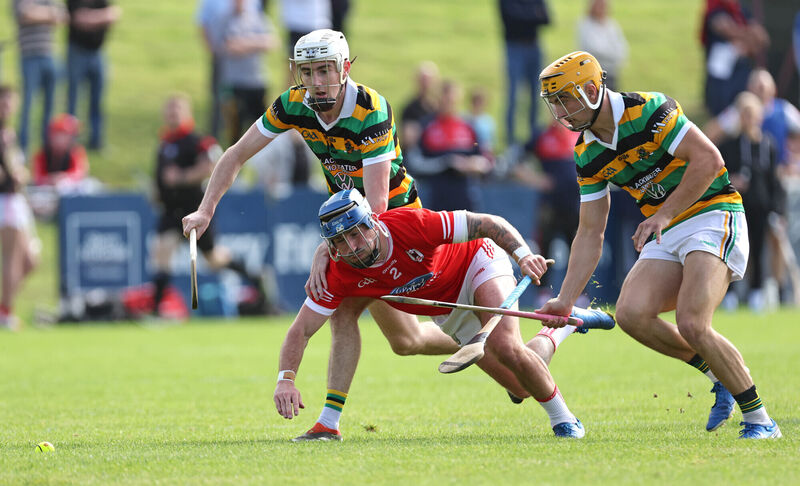  Eoin O'Leary and Micheál Mullins of Glen Rovers battle against Charleville's Darren Butler on Sunday. Picture: Jim Coughlan