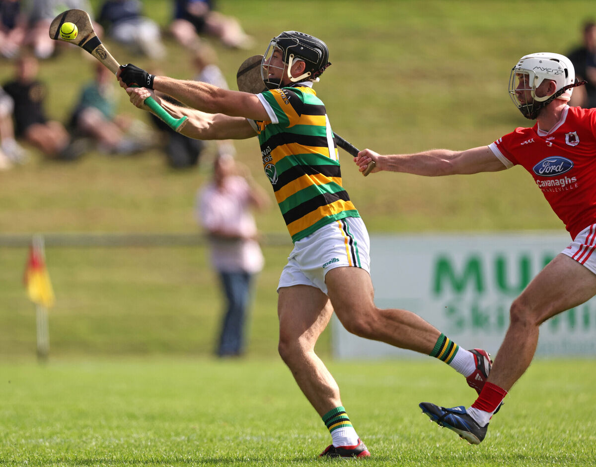Simon Kennefick, Glen Rovers, gets his shot away to score the first Glen Rovers goal, under pressure from Jack Meade, Charleville. Picture: Jim Coughlan. Simon Kennefick, Glen Rovers, gets his shot away to score the first Glen Rovers goal, under pressure from Jack Meade, Charleville. Picture: Jim Coughlan.