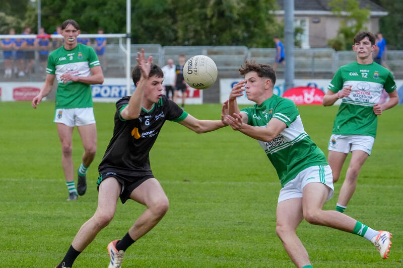 Shane Flynn, Diarmuid Ó Murchu, tussles for possession with Macroom’s Aled Hopkins. Picture: Noel Sweeney