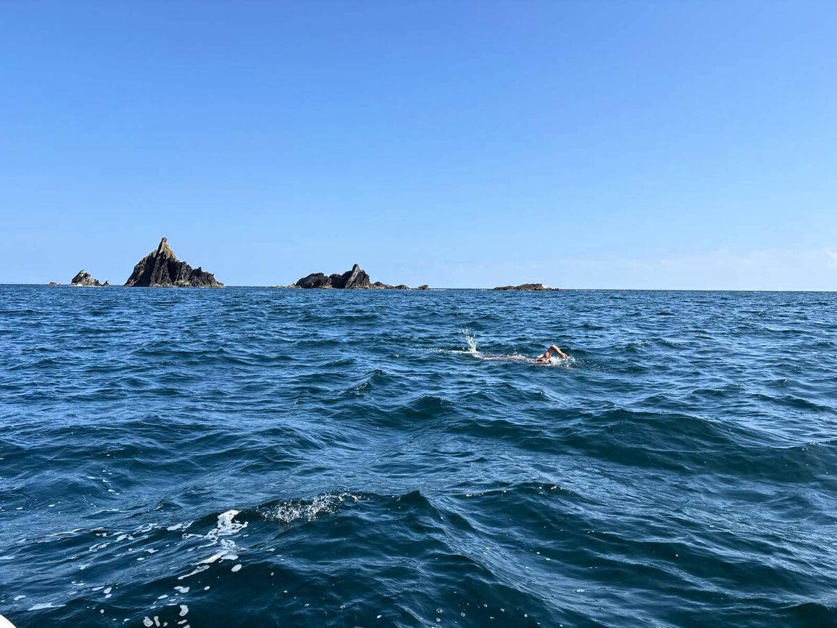 Olga O'Sullivan swimming away from Stag Rocks. Olga O'Sullivan swimming away from Stag Rocks.