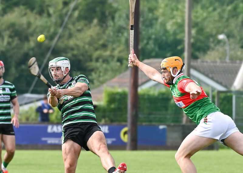 Douglas' Shane Kingston scores a point despite the efforts of Fr O'Neills defender Mark O'Keeffe. Picture: David Keane. Douglas' Shane Kingston scores a point despite the efforts of Fr O'Neills defender Mark O'Keeffe. Picture: David Keane.