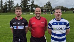 <p>St Nicks captain Eoghan Varian, referee Alan Hourihan and Kinsale captain Niall McCarthy before the Premier Junior Football quarter-final at Shanbally. Picture: JJ Hurley.</p>