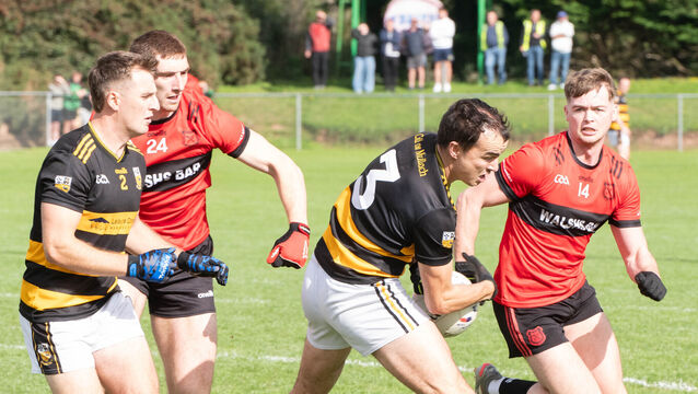 <p>Buttevant's Jamie Whelan battles Mitchelstown's Cathal O'Mahony and Mark Keane during the IAFC quarter-final match in Glanworth. Picture: Howard Crowdy</p>